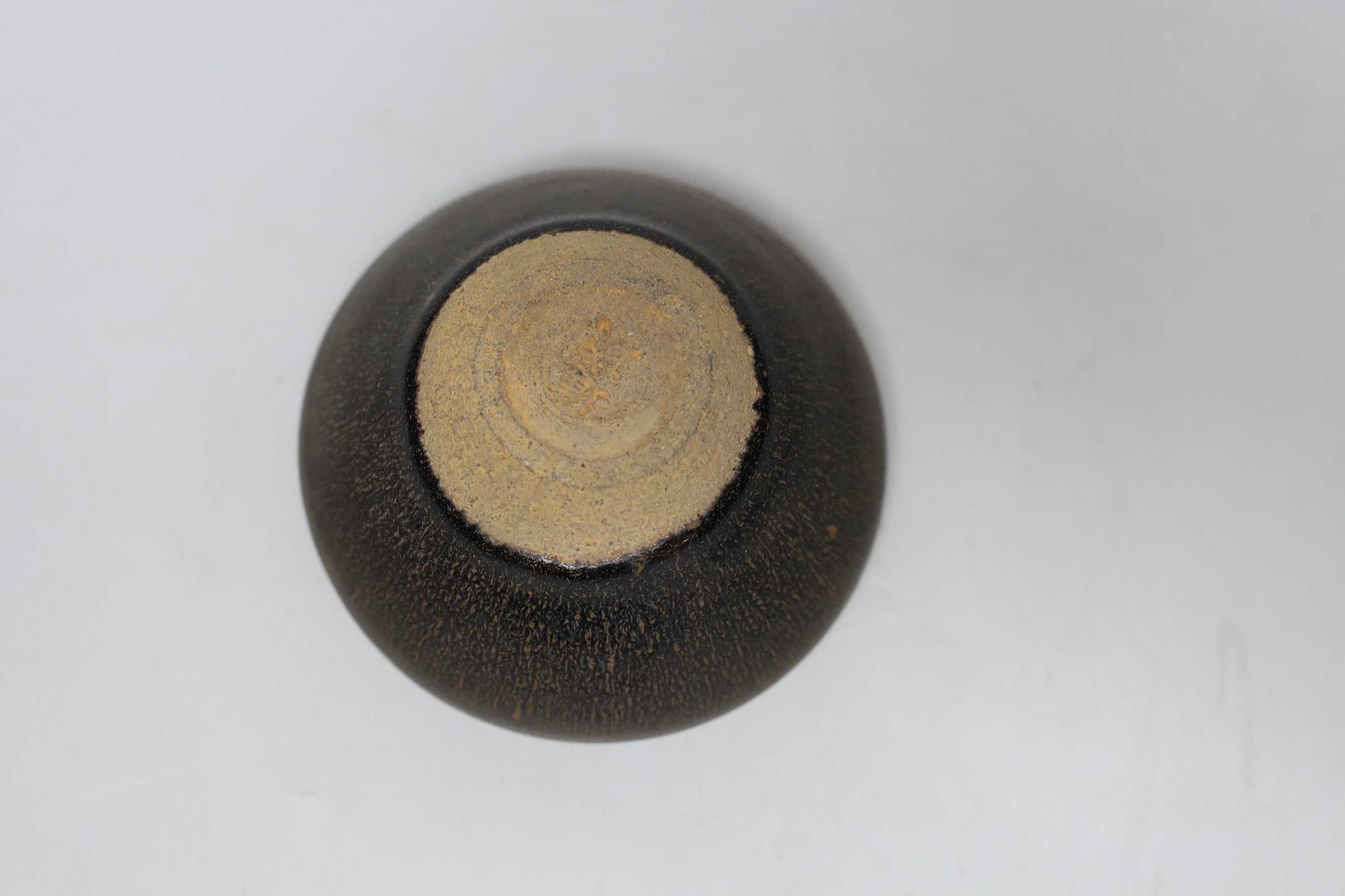 A Chinese brown pottery bowl, 11.5cms diameter